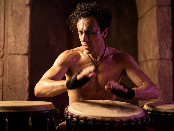 Web art ai made, Ramelan myth shirtless playing hand drums